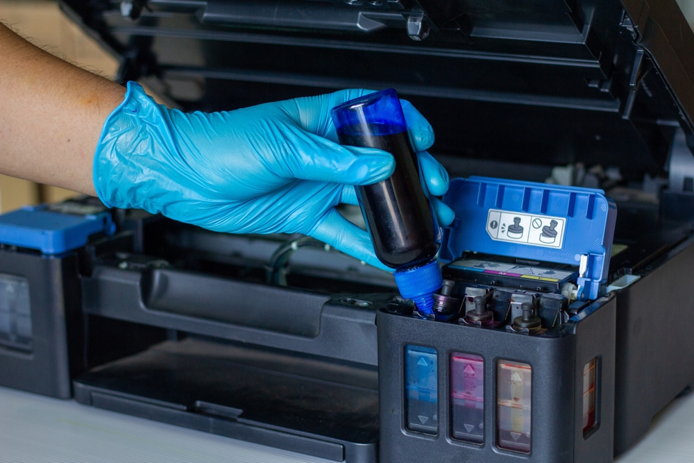 Technicians Refill ink cartridges, printer Inkjet colors.Printer Repairs and Maintenance inkjet or Laser printers concept ,selective focus